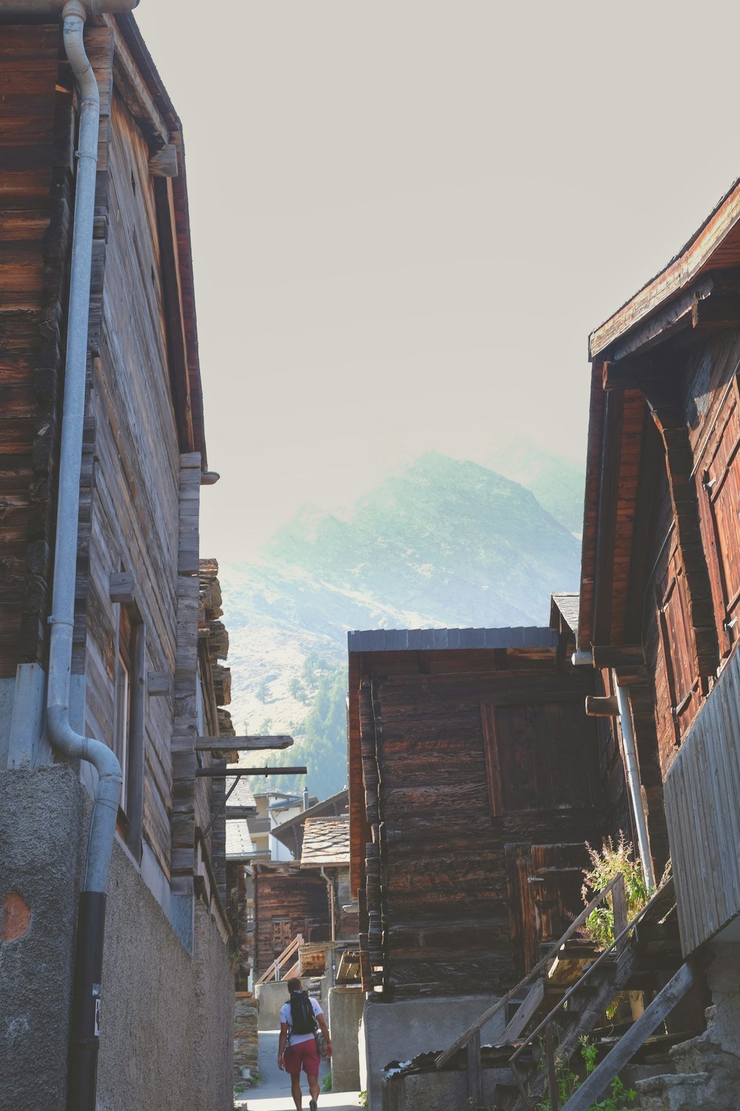 About a-person-walking-down-a-narrow-alley-way-bclmxkbvonk
